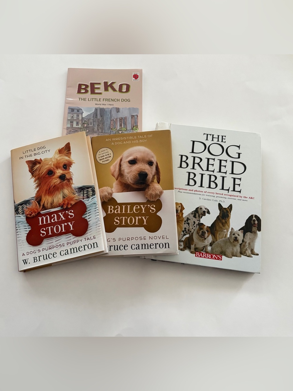 Bundle of 4 dog books. 3 heartwarming dog tales and 1 guide to dog breeds GUC